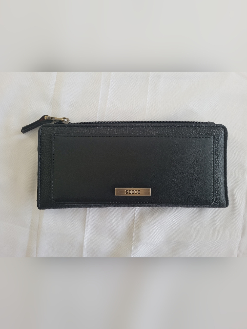 ROOTS Black Leather Zip Wallet with Brass Logo